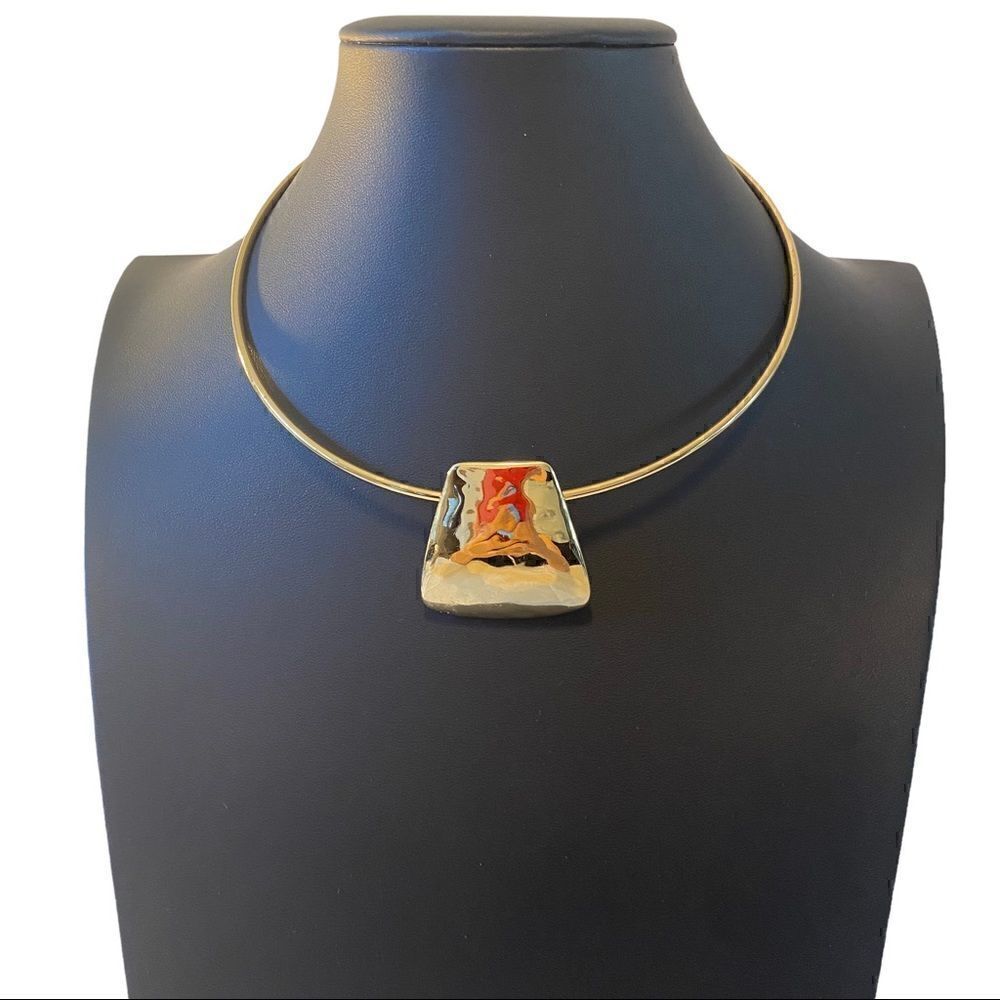 Simply Elegant Gold Toned Slider with Rounded Trapezoid Shaped Pendant.